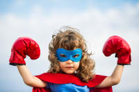 Superhero kid. Girl power concept Pulse surveys